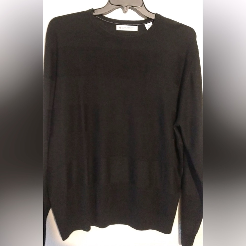 Black sweater by Ryan Seacrest.